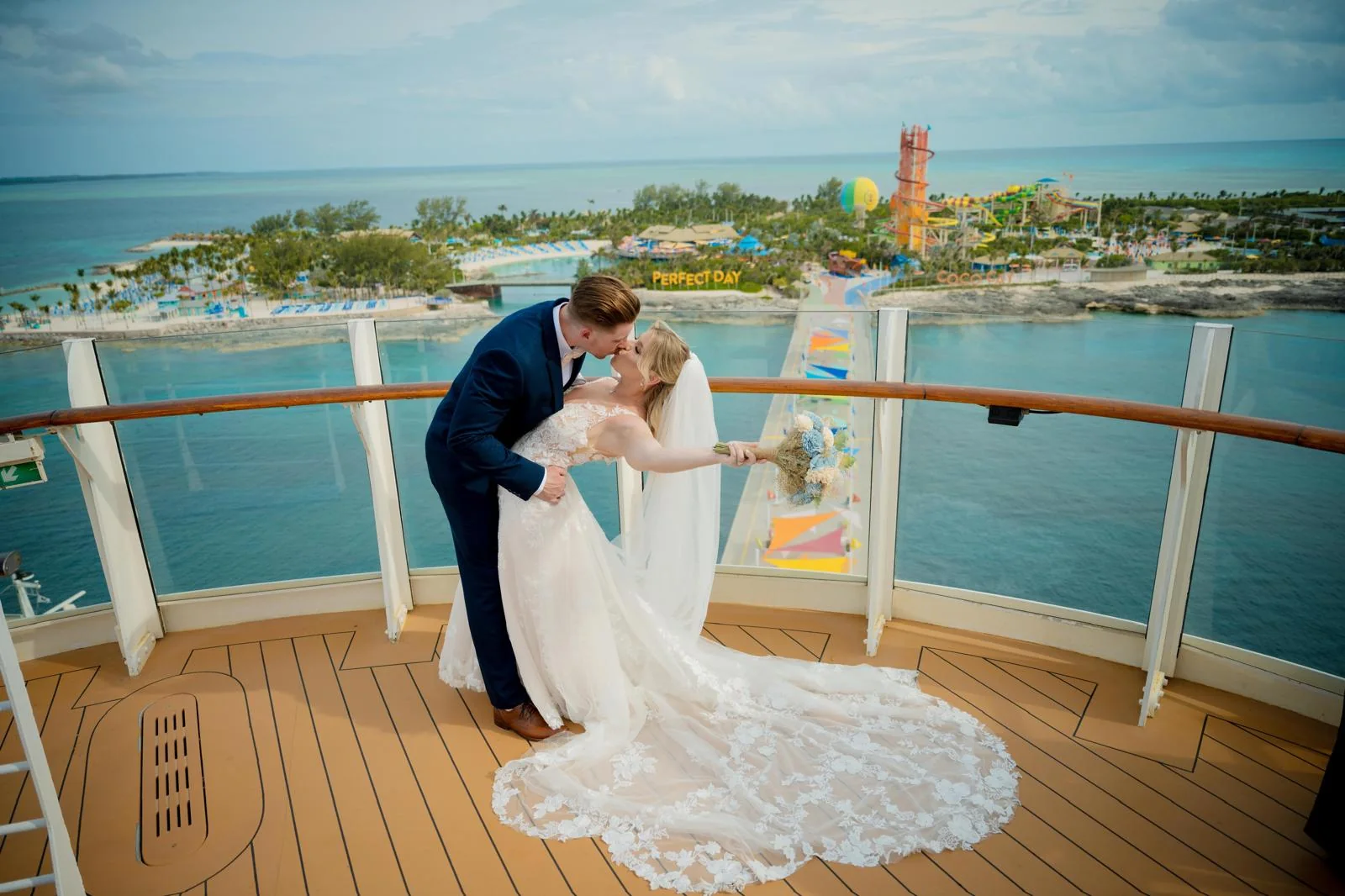 Cruise wedding couple with Perfect Day at CocoCay in the background